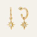 designed in house by mettle and bloom, the star drop earrings are a hoop earring with a star suspended from it. 